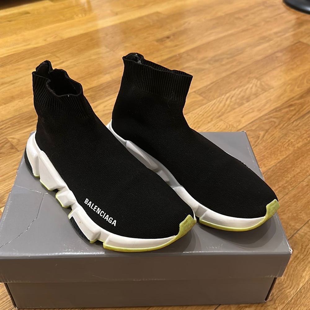 Balenciaga Speed Runner slip on sneaker with lime green sole.